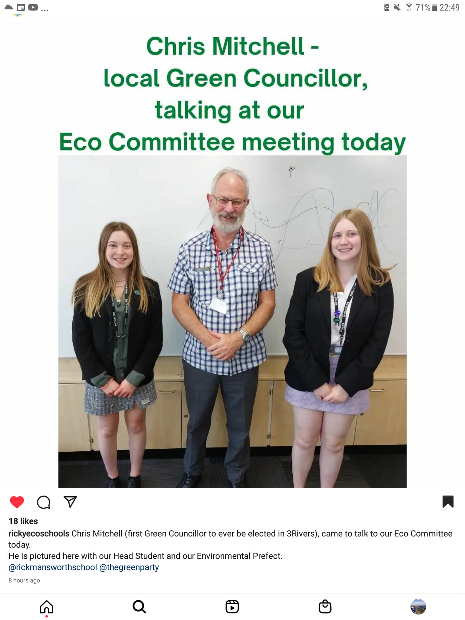Screenshot from Ricky School social media. Chris stands in between two school girls smiling. The caption reads "Chris Mitchell, local Green Councillor, talking at our Eco Committee meeting today